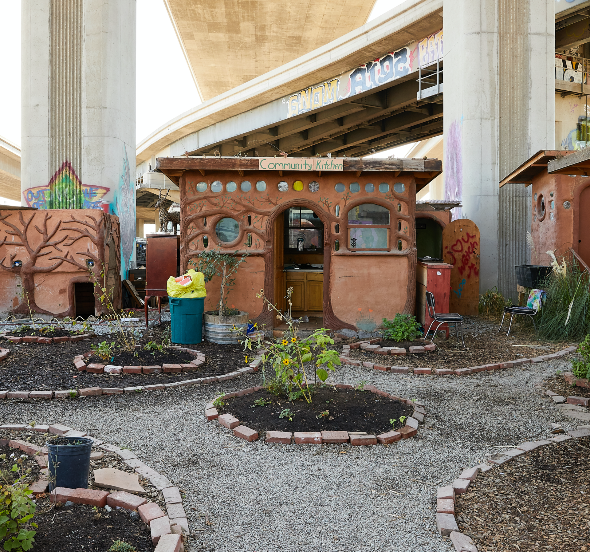 A picture of Cob on Wood’s communal space, which includes a kitchen, bathroom, free store, garden, and gathering space