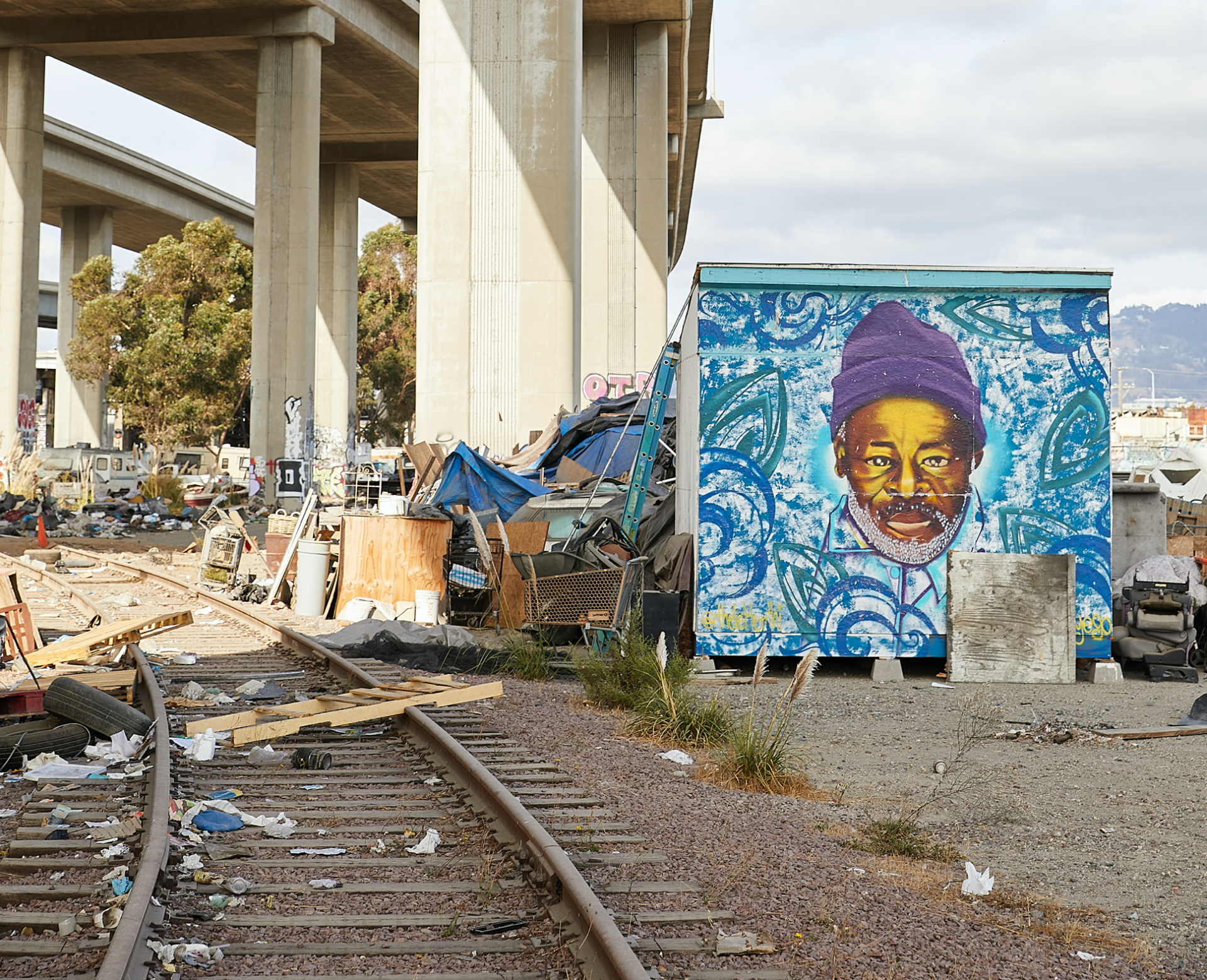 Ramona's home, which was constructed from found materials and decorated with a portrait of her late father, was the first to be built on Caltrans land